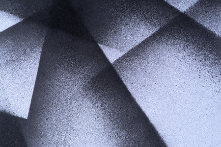 Black spray paint on a white backgroundの写真素材