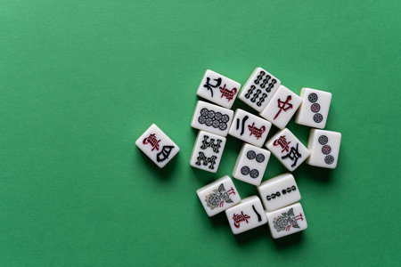 Mahjong tiles on a green backgroundの写真素材