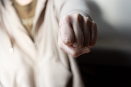 Woman's hand with a clenched fist