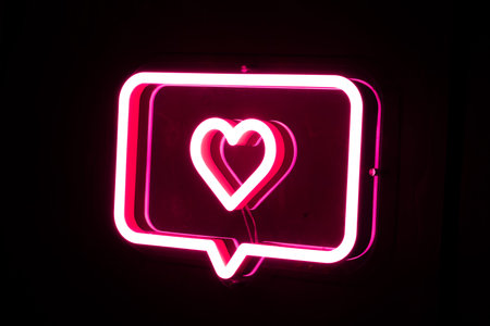 Glowing pink heart neon tubeの写真素材