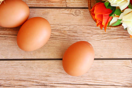 Fresh eggs on wood backgroundの写真素材