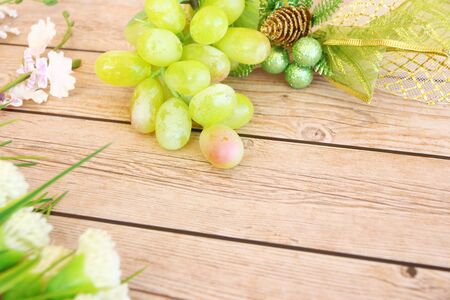 Portion of fresh Green Grapes on vintage wooden backgroundの写真素材