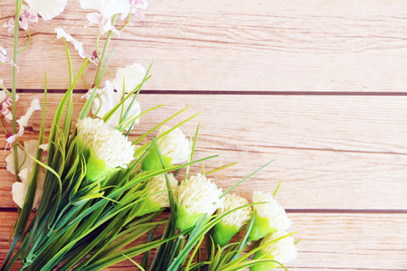 flowers over grunge wooden backgroundの写真素材