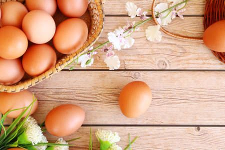 Fresh eggs on wood backgroundの写真素材
