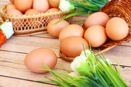 Fresh eggs on wood backgroundの写真素材
