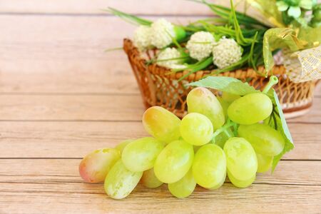 Portion of fresh Green Grapes on vintage wooden backgroundの写真素材