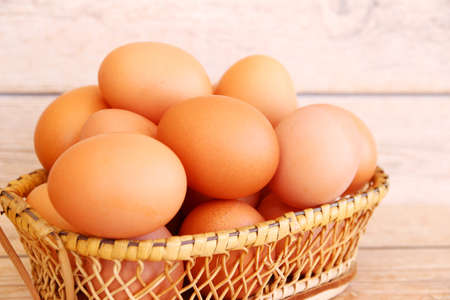 Fresh eggs on wood backgroundの写真素材
