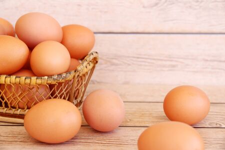 Fresh eggs on wood backgroundの写真素材