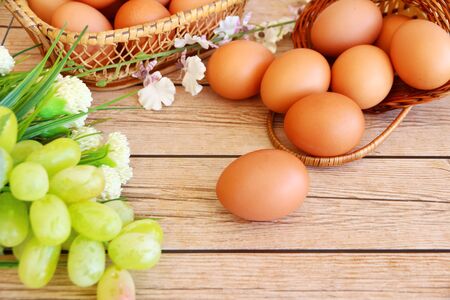 Fresh eggs on wood backgroundの写真素材