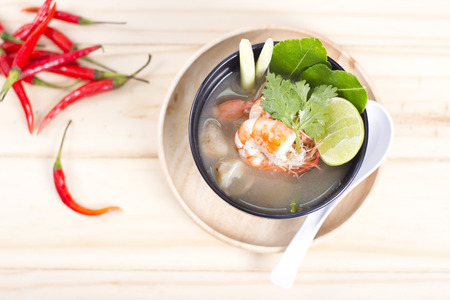 The hot and famous Tom Yum Khung nature of Thailand on wooden background.の写真素材