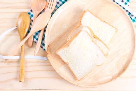 White fresh bread on wooden background from my idea.