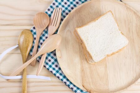White fresh bread on wooden background from my idea.の写真素材