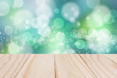 Wooden board on Blue sky colorful bokeh background from my idea.の写真素材