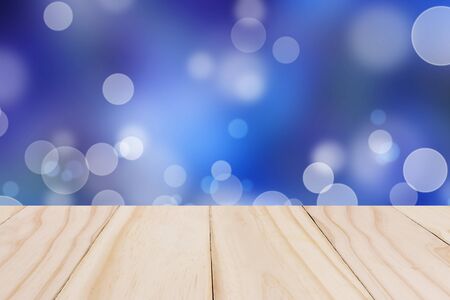Wooden board on Blue sky colorful bokeh background from my idea.