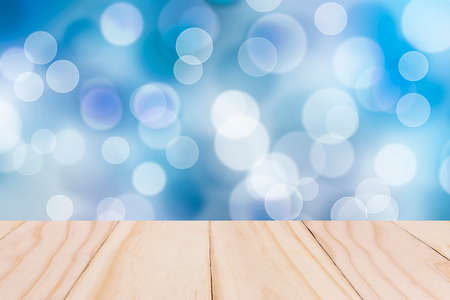 Wooden board on Blue sky colorful bokeh background from my idea.の写真素材