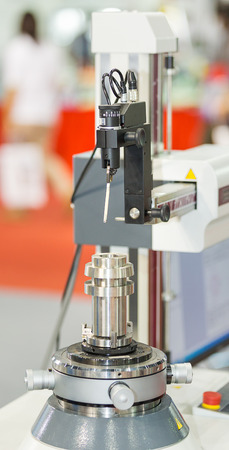 operator measuring steel cnc turning automotive part  part by roundness testerの写真素材