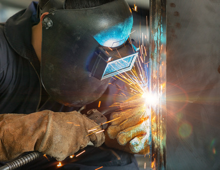 worker welding construction by MIG weldingの写真素材