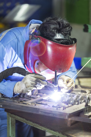 operator repair mold by TIG welding in manufacturing factoryの写真素材