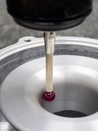 operator inspection aluminum automotive parts by CMMの写真素材