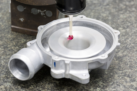 operator inspection aluminum automotive parts by CMMの写真素材