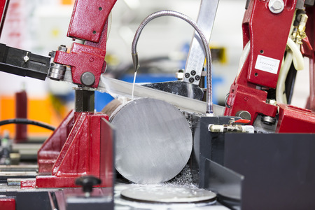band saw cutting tool steel bar by automatic feedの写真素材