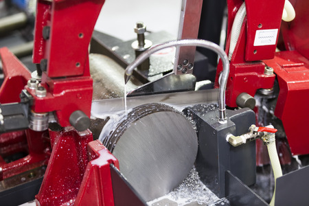 band saw cutting tool steel bar by automatic feedの写真素材