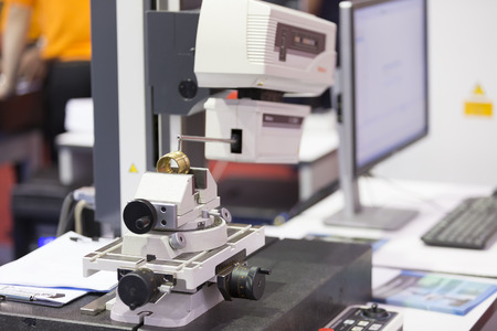 operator inspection automotive part by contour measuring machineの写真素材