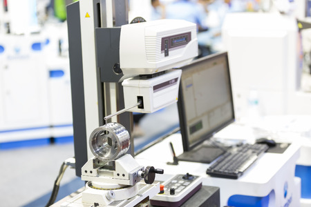 operator inspection automotive part by contour measuring machineの写真素材