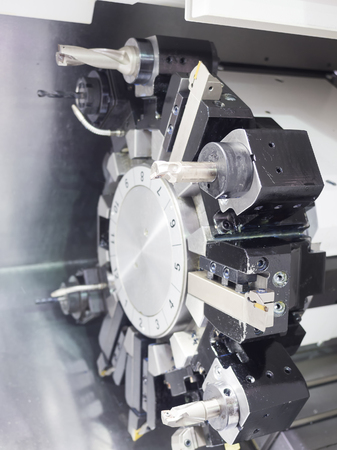 Operator machining automotive part by cnc turning machineの写真素材