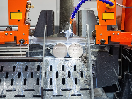 band saw cutting tool steel bar by automatic feed, high performance cutting machine, cutting steel bar, high speed cutting, band saw for industrial useの写真素材