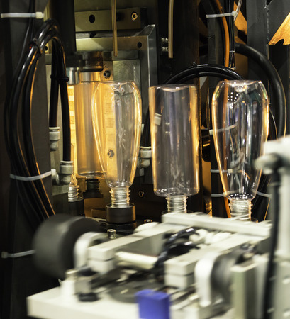 Plastic bottle hot blow manufacturing, bottle blow mold, bottle production machineの写真素材