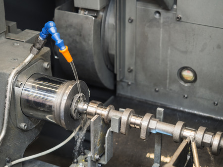 automotive industrial metal work machining process by cutting tool on CNC latheの写真素材