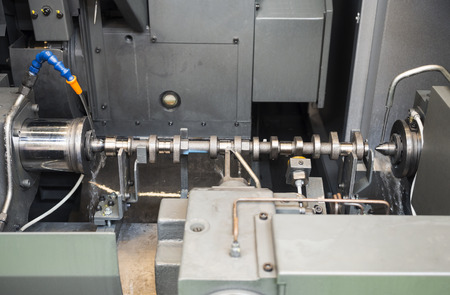 automotive industrial metal work machining process by cutting tool on CNC latheの写真素材