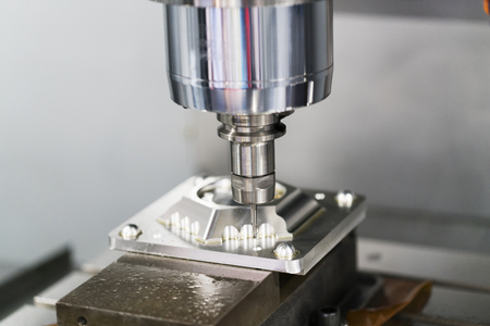 machining precision part by CNC machining centerの写真素材