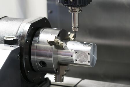 machining precision part by CNC machining centerの写真素材
