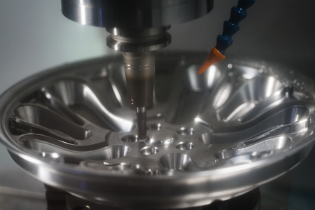 machining precision part by CNC machining centerの写真素材