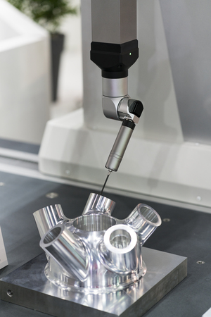 operator inspection aluminum automotive parts by CMM, Dimension inspection for high precision manufacturing process, Automatic check tolerance and geomatric of machining partの写真素材