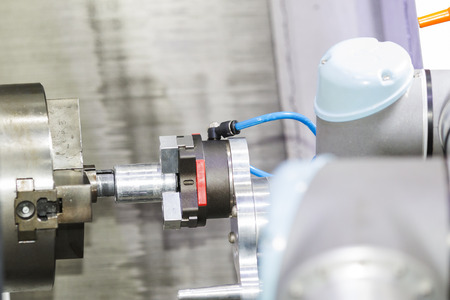 Robot arm auto load and unload CNC turning part by M cod G code and teaching mode, automatic programable robot arm for modern industrial.の写真素材