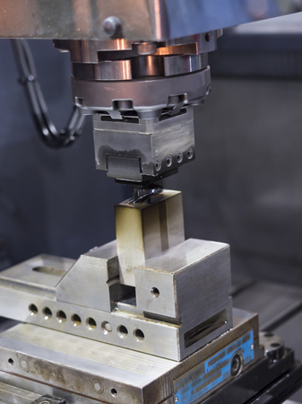 operator use copper EDM electrod to make precision mold and dieの写真素材