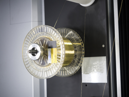 CNC wire cut machine cutting high precision mold parts, cutting metal by electric discharge, high technology wirecut machine for precision manufacturingの写真素材