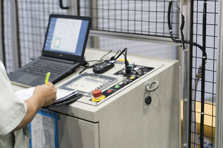 CNC Machine control panel closup, automatic robot input program and maintenance process, Operation...