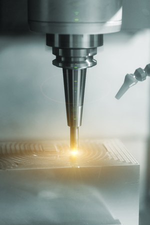 Machining precision part by CNC machining centerの写真素材