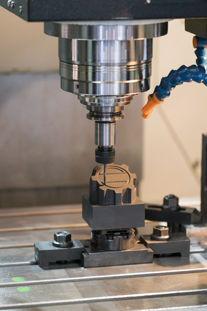 Machining precision part by CNC machining centerの写真素材