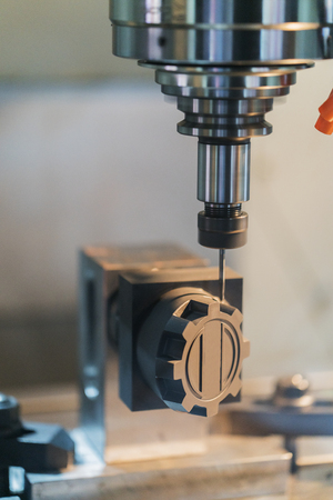 machining precision part by CNC machining centerの写真素材