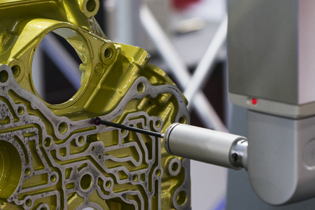 operator inspection aluminum automotive parts by CMM, Dimension inspection for high precision manufacturing process, Automatic check tolerance and geomatric of machining partの写真素材