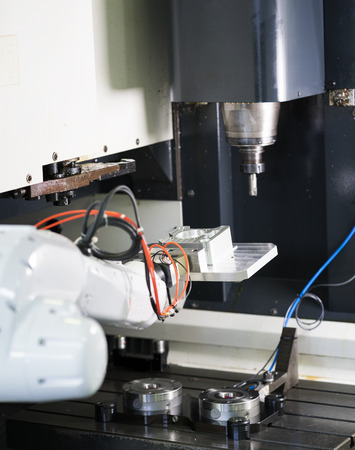 machining precision part by CNC machining centerの写真素材