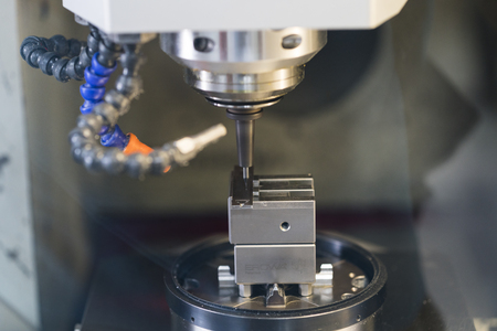 machining precision part by CNC machining centerの写真素材