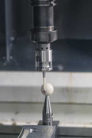 operator inspection aluminum automotive parts by CMM, Dimension inspection for high precision manufacturing process, Automatic check tolerance and geomatric of machining partの写真素材