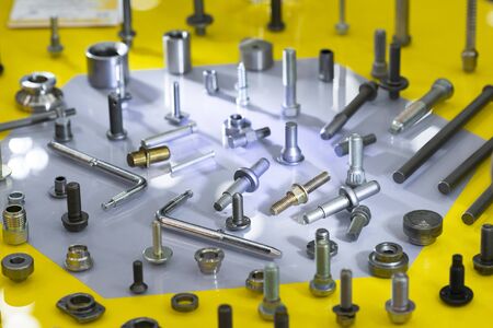 screw on blue background. Industirial screw and bolt manyfacturing. screw coating with chromium zinc plating anodizing.の写真素材