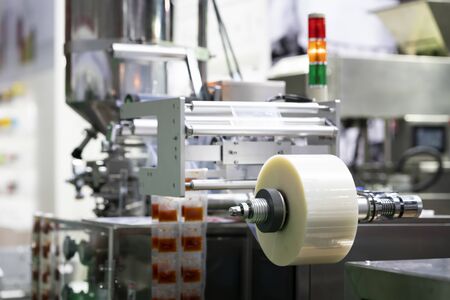 Automatic packing machine with plastic bag and paper box, high speed packing machine for food product industrial, high technology manufacturing processの写真素材